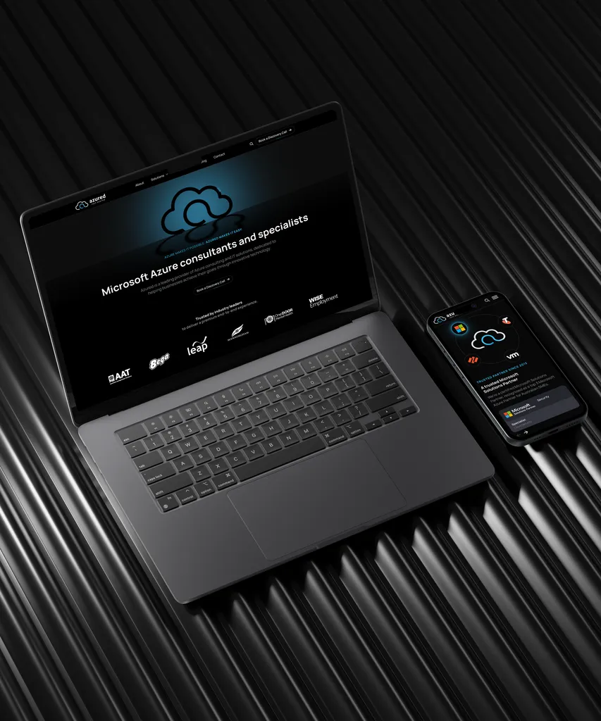 I.T. solutions business website design mockup on laptop and mobile